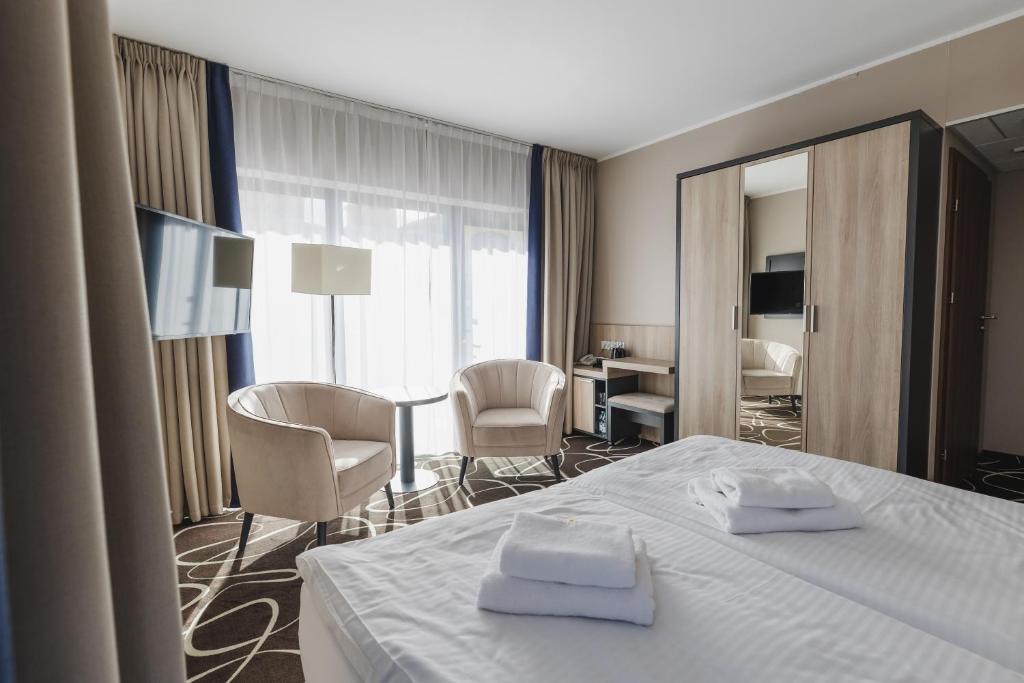 Postel nebo postele na pokoji v ubytování Trofana Wellness & SPA