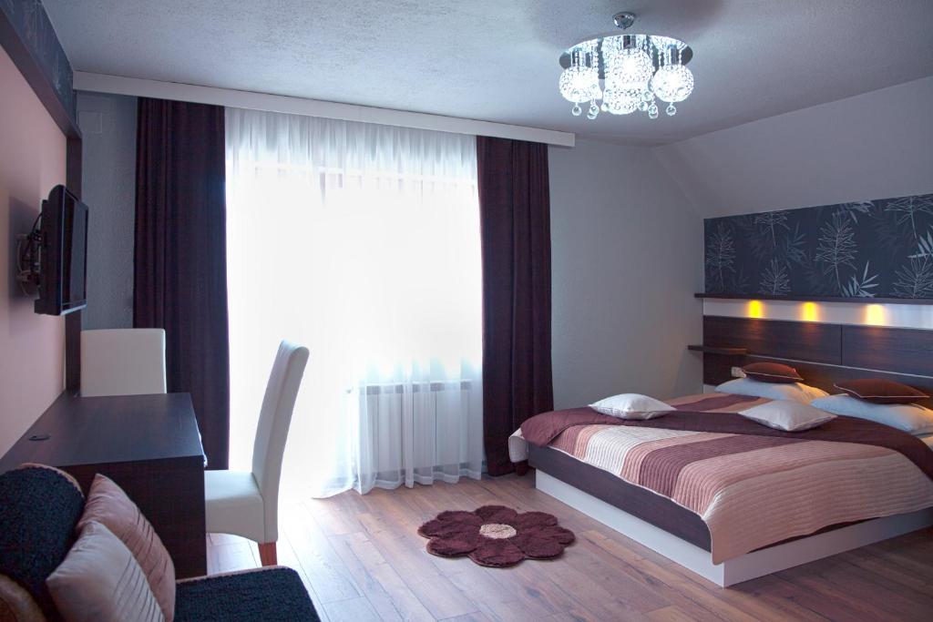 Postel nebo postele na pokoji v ubytování Guesthouse Villa Plitvička