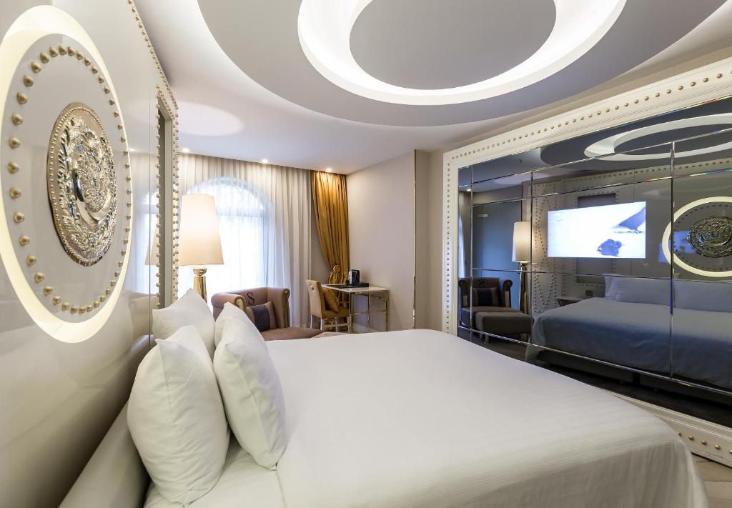 A bed or beds in a room at Sura Design Hotel & Suites
