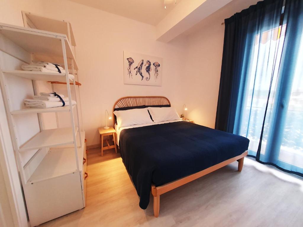 a bedroom with a bunk bed and a ladder at NUMANA SEA APARTMENT in Numana