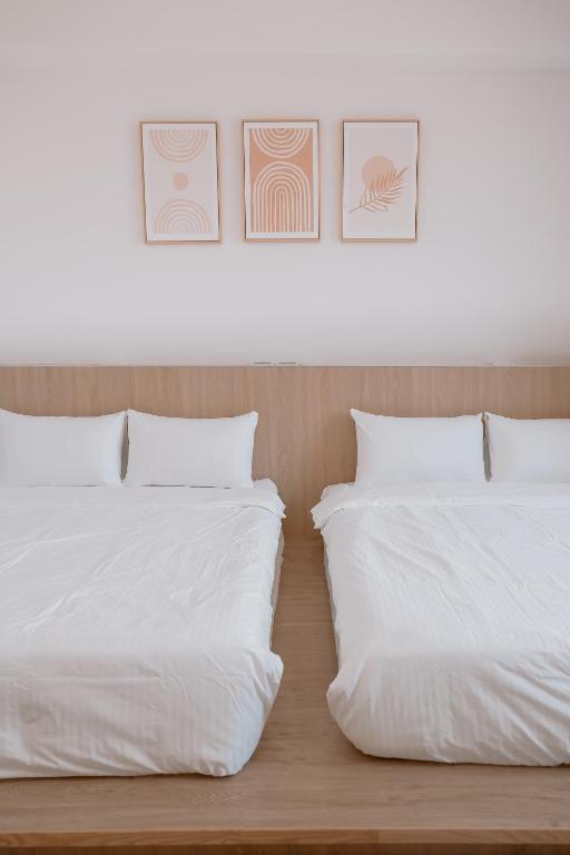 Postel nebo postele na pokoji v ubytování Huiwei B&B