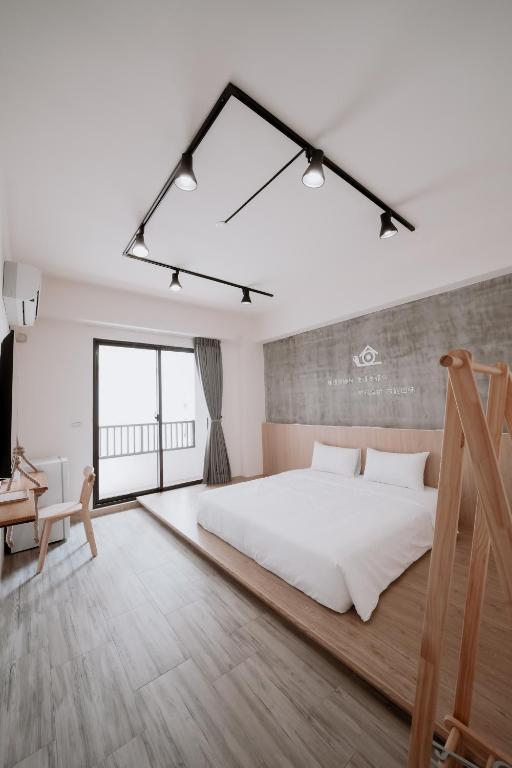 Postel nebo postele na pokoji v ubytování Huiwei B&B