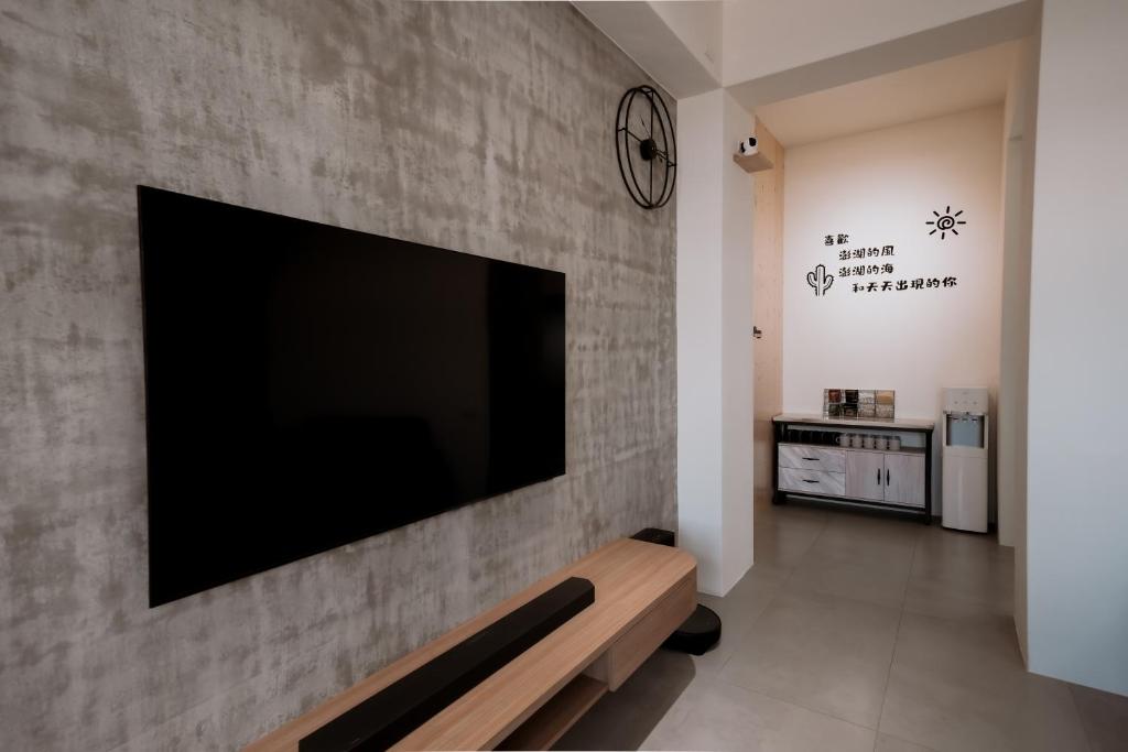 TV a/nebo společenská místnost v ubytování Huiwei B&B
