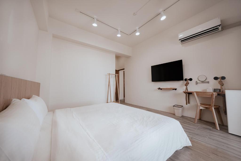 Postel nebo postele na pokoji v ubytování Huiwei B&B