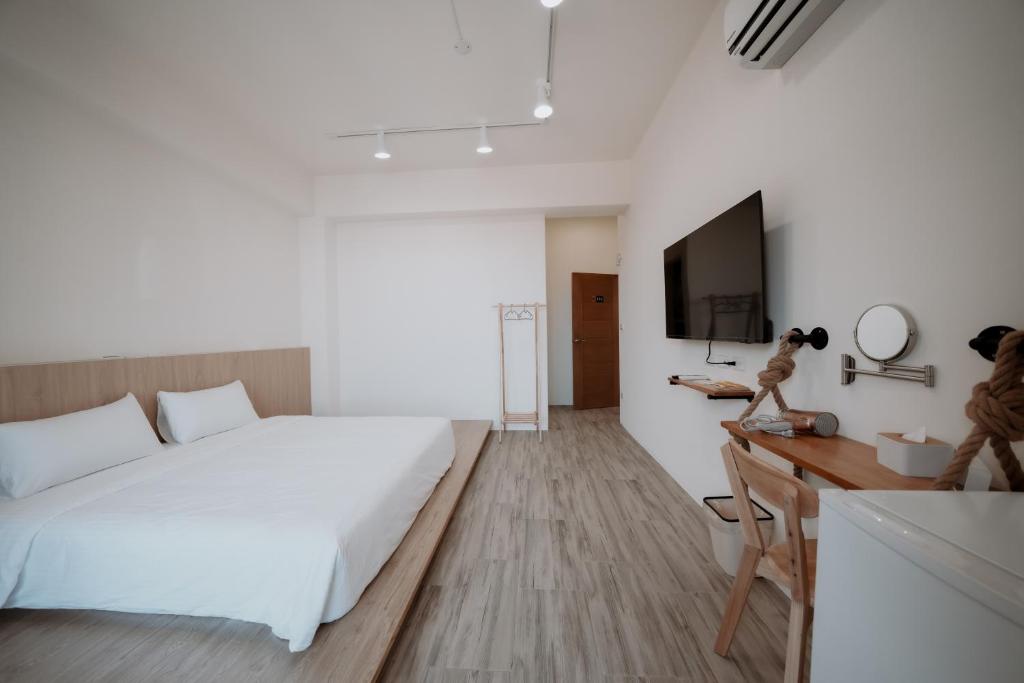 Postel nebo postele na pokoji v ubytování Huiwei B&B