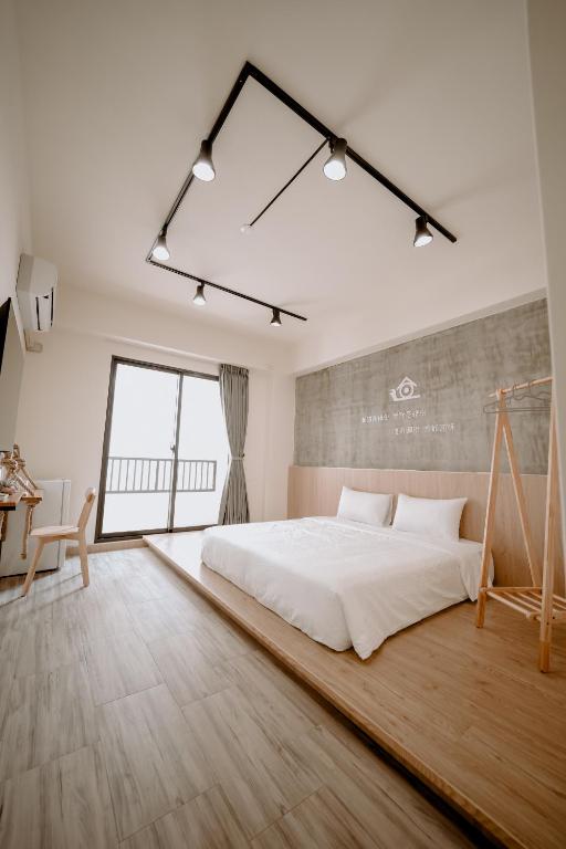 Postel nebo postele na pokoji v ubytování Huiwei B&B