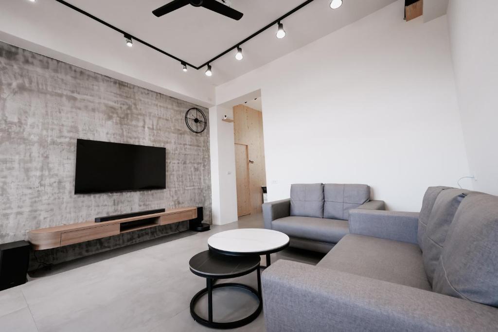 TV a/nebo společenská místnost v ubytování Huiwei B&B
