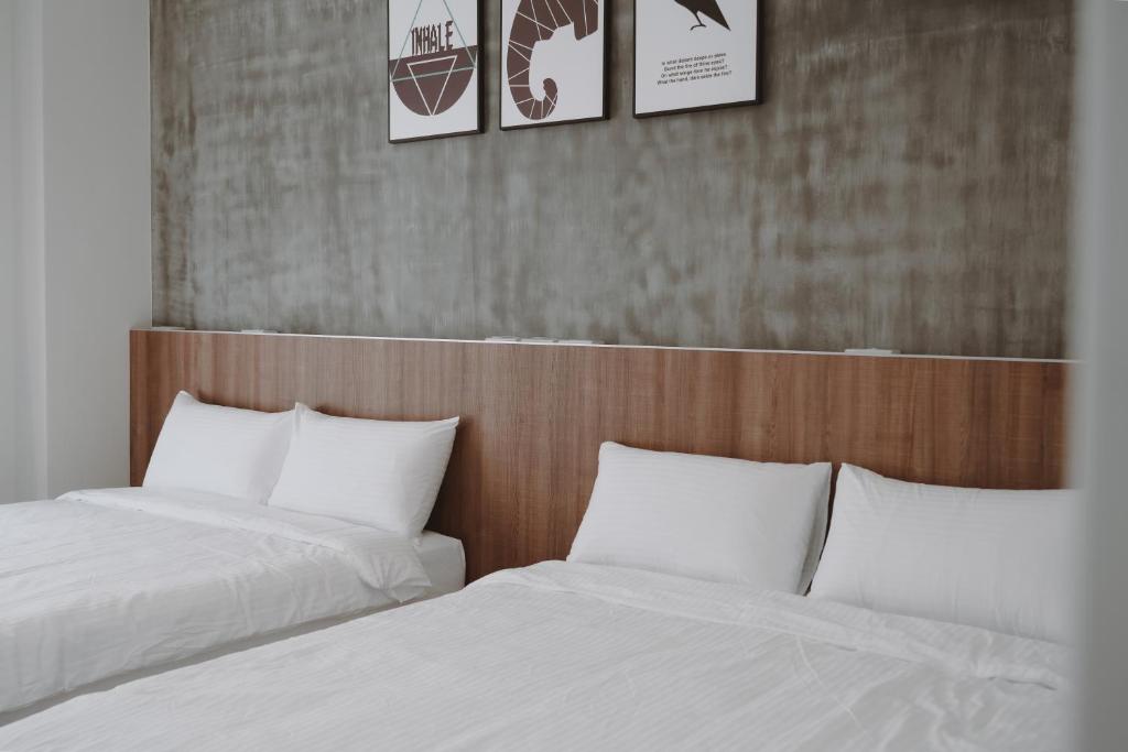 Postel nebo postele na pokoji v ubytování Huiwei B&B
