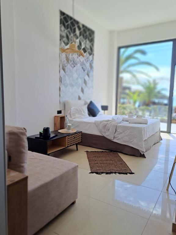 Postel nebo postele na pokoji v ubytování Beach Hotel Kapahi