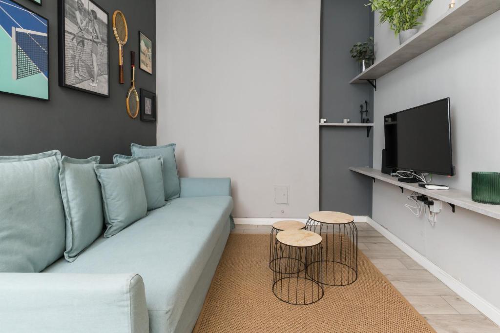 Televízia a/alebo spoločenská miestnosť v ubytovaní Trendy Design Apartment