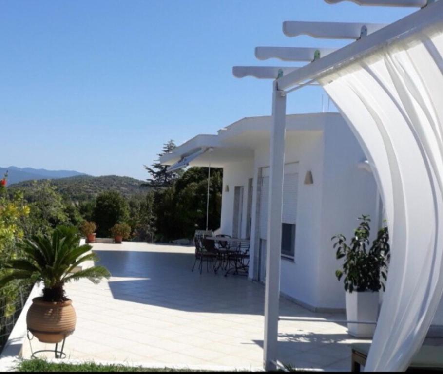 a view of a house with a patio with at Seaview dreams in Ormos Panagias