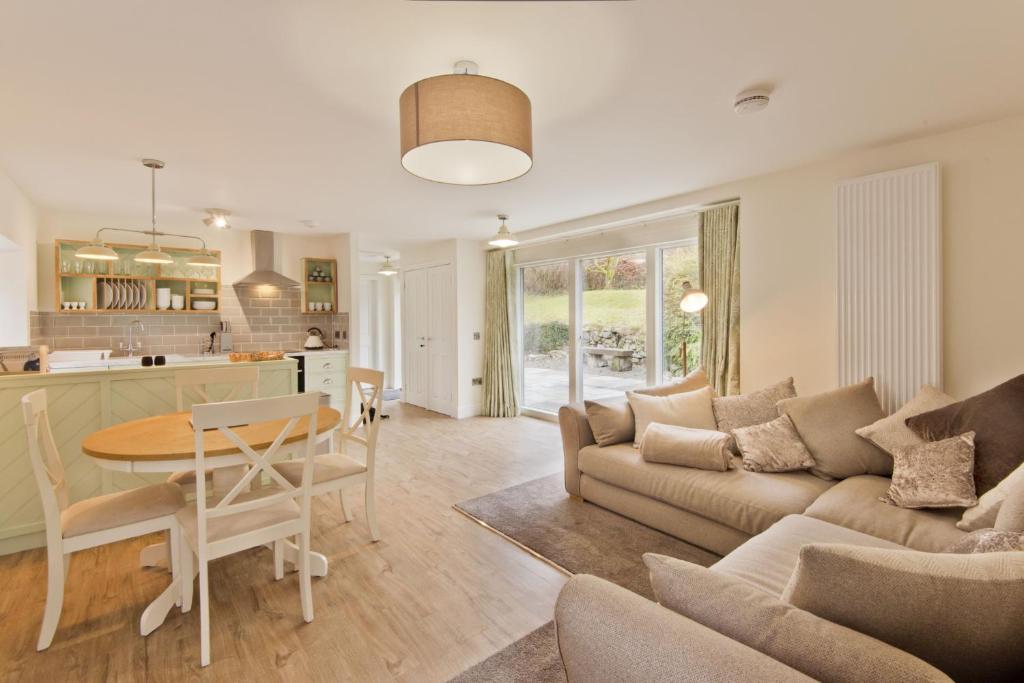 a living room with a couch and a table at Skerrow in New Galloway