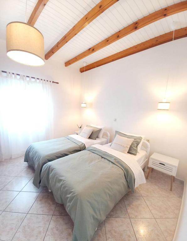 Postel nebo postele na pokoji v ubytování Manolia Apartments