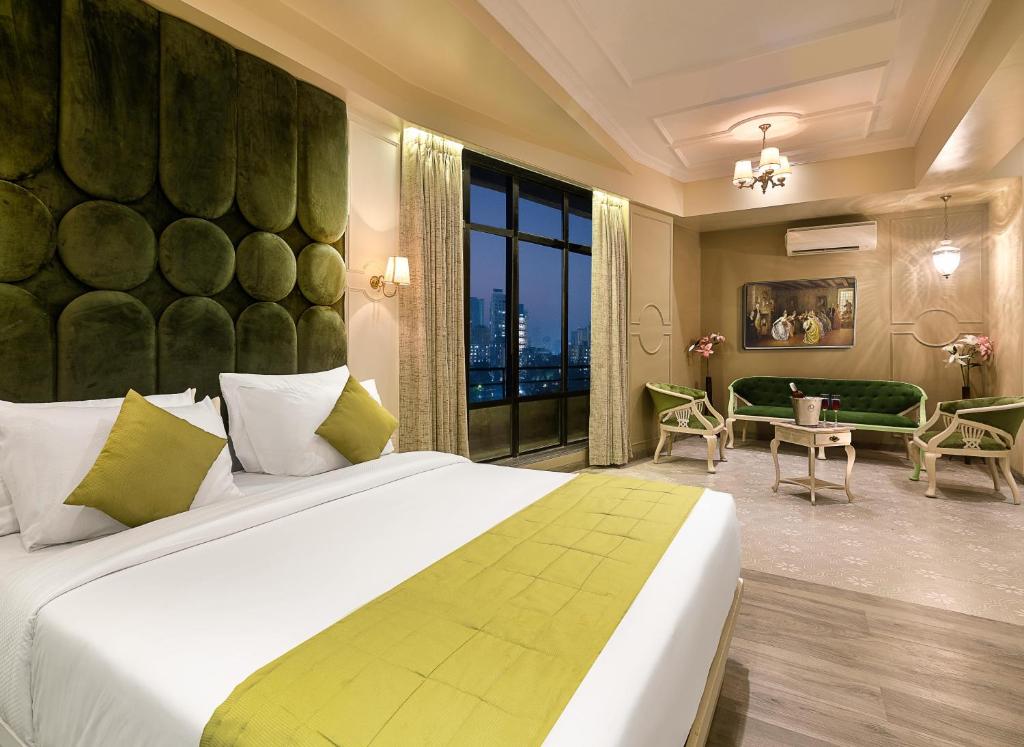 Postel nebo postele na pokoji v ubytování Arnna Hotel - Goregaon