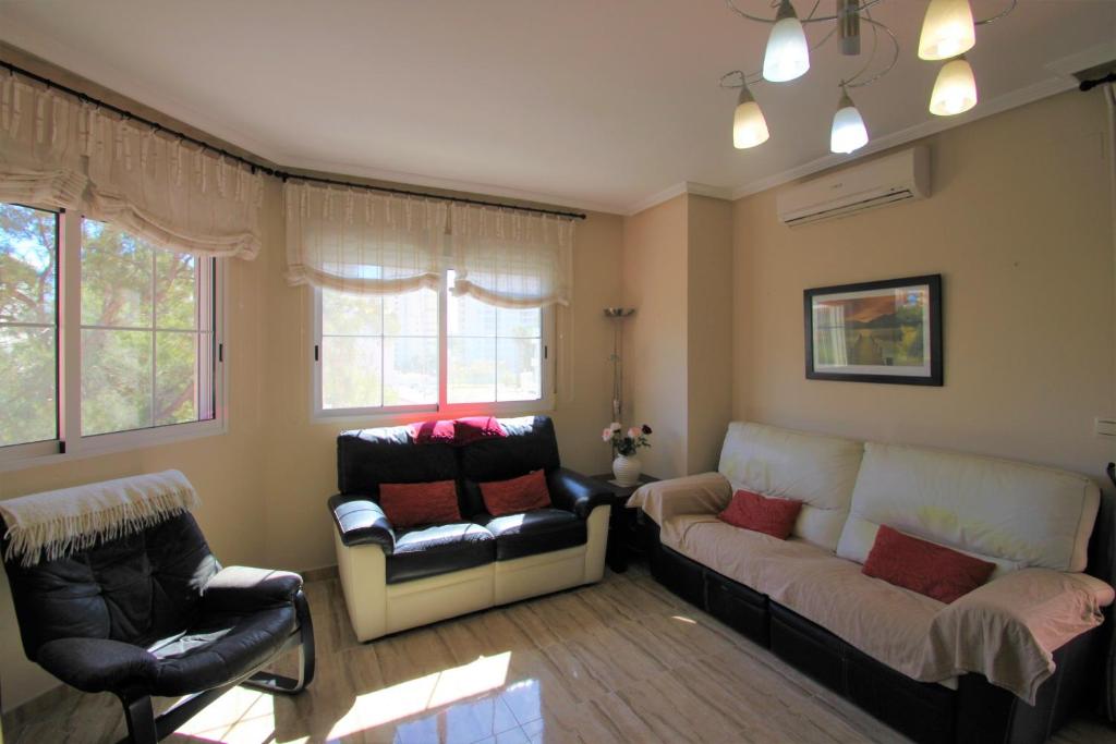 Posezení v ubytování Apartamento con magnífica terraza en El Campello C105