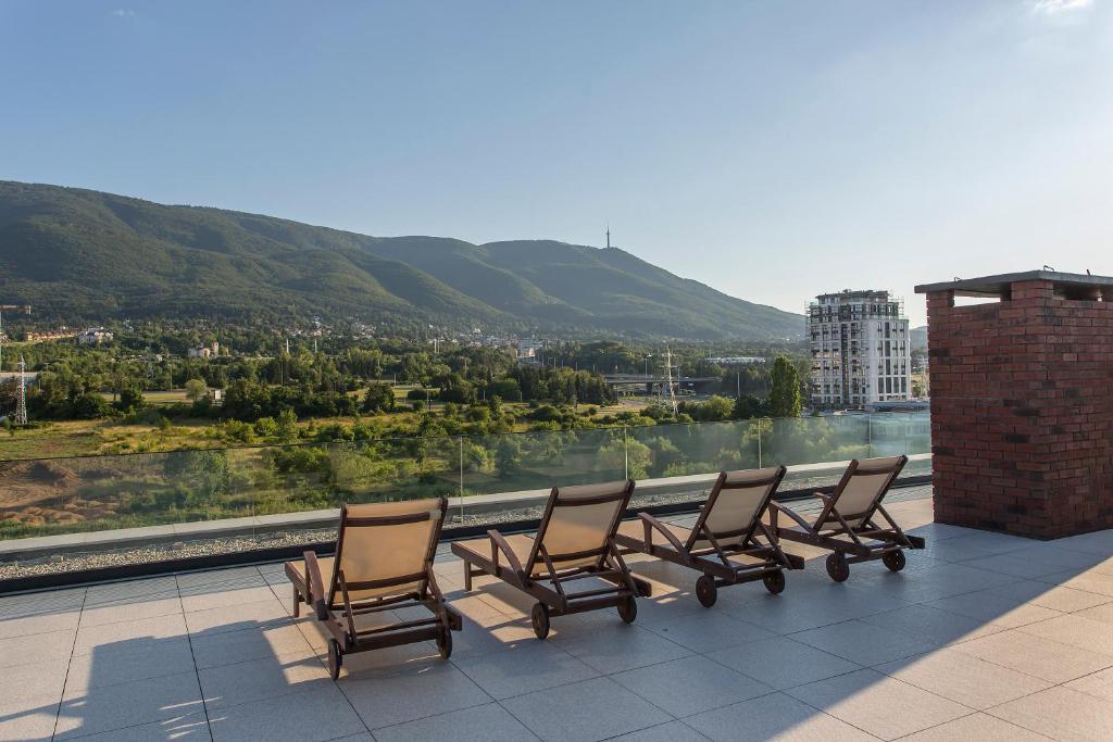 a group of chairs sitting on top of a roof at Complex Gallery Vitosha **** in Sofia