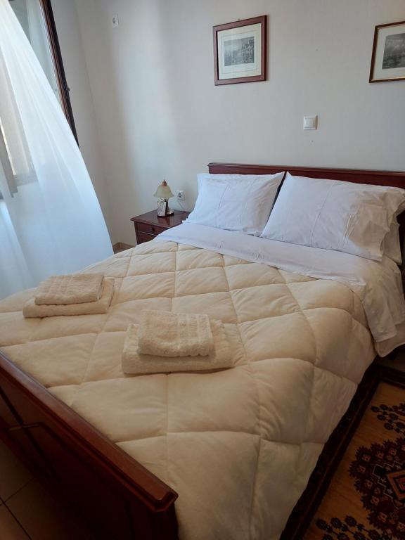 Postel nebo postele na pokoji v ubytování GEORGE's VILLA