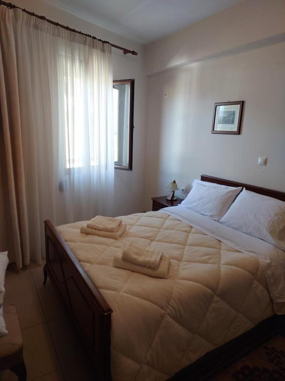 Postel nebo postele na pokoji v ubytování GEORGE's VILLA