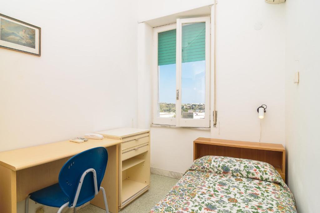 Postel nebo postele na pokoji v ubytování Hotel Riviera
