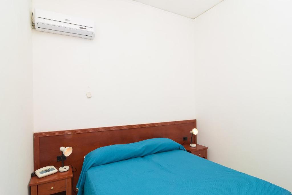 Postel nebo postele na pokoji v ubytování Hotel Riviera