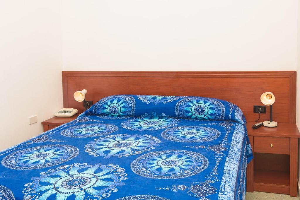 Postel nebo postele na pokoji v ubytování Hotel Riviera