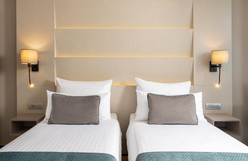 Postel nebo postele na pokoji v ubytování Leonardo Hotel Bucharest City Center