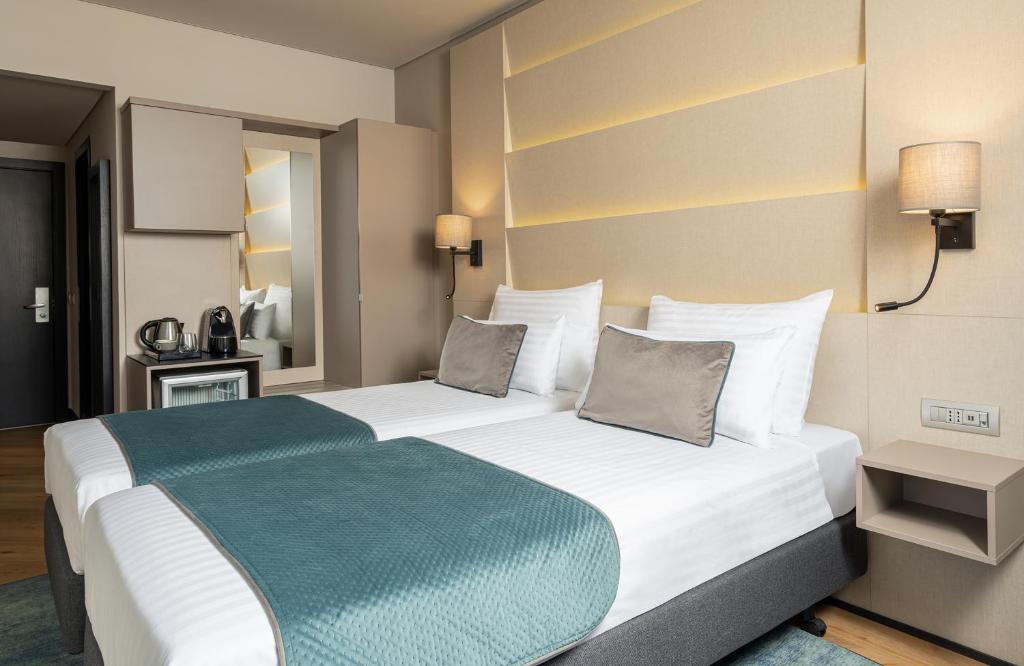 Postel nebo postele na pokoji v ubytování Leonardo Hotel Bucharest City Center