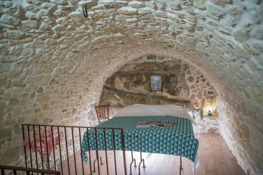 Posteľ alebo postele v izbe v ubytovaní Case degli Avi 2, antico abitare in grotta