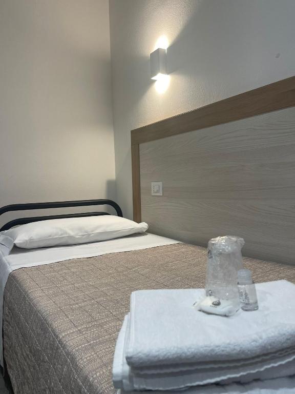 Postel nebo postele na pokoji v ubytování Hotel 26