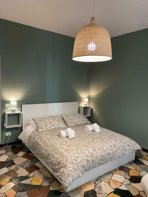 Łóżko lub łóżka w pokoju w obiekcie Delle Rose Rooms