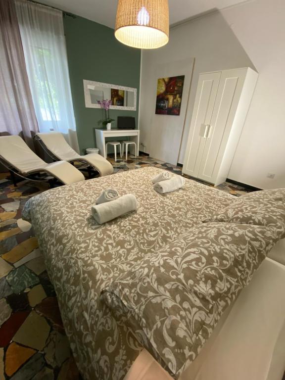 Łóżko lub łóżka w pokoju w obiekcie Delle Rose Rooms