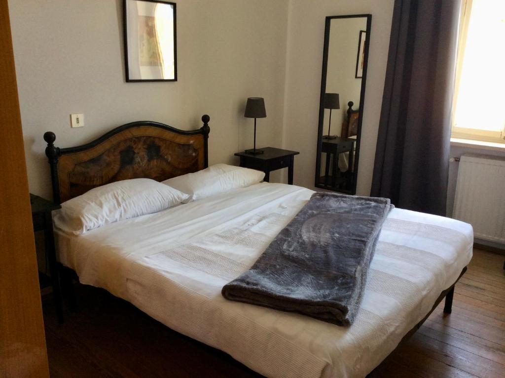 Postel nebo postele na pokoji v ubytování Albergo Gargnano