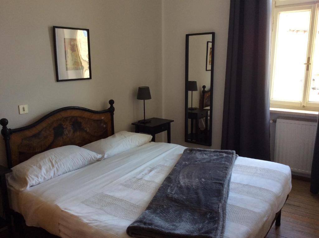 Postel nebo postele na pokoji v ubytování Albergo Gargnano