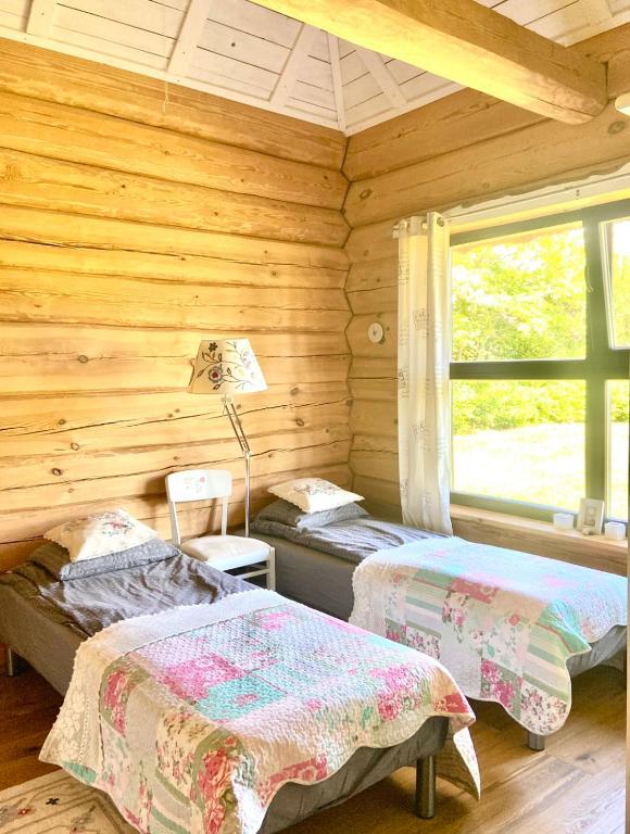 Postel nebo postele na pokoji v ubytování Kandimaa villa Saaremaal