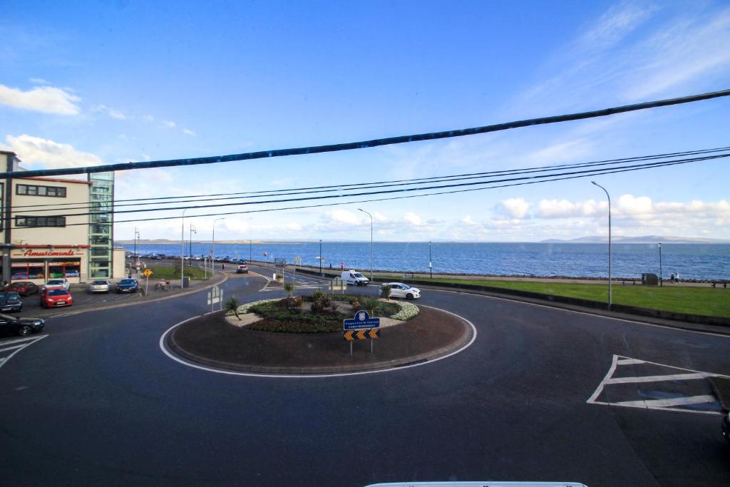 an empty street with a view of the ocean at Seaside Views in Galway