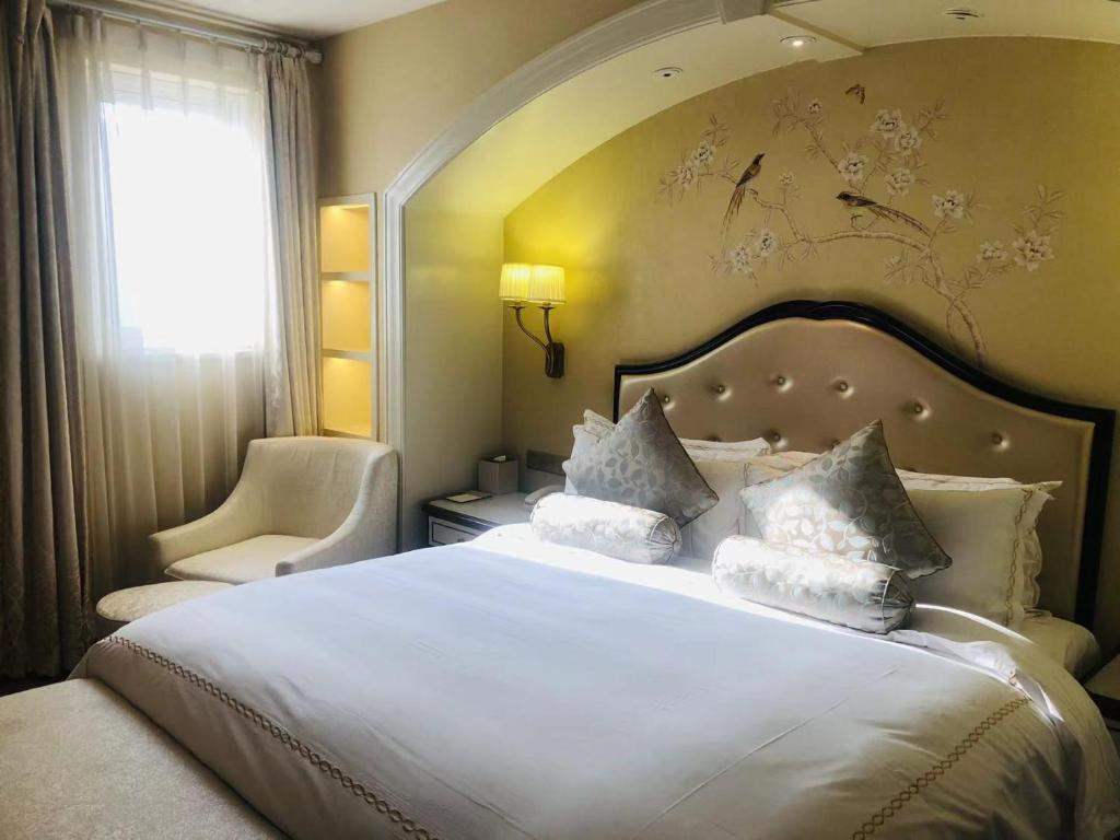 Postel nebo postele na pokoji v ubytování Urban Island Hotel Shanghai