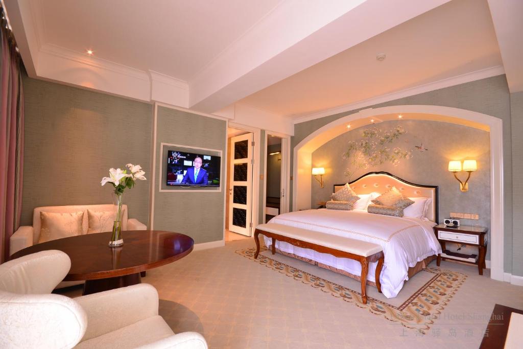 Postel nebo postele na pokoji v ubytování Urban Island Hotel Shanghai