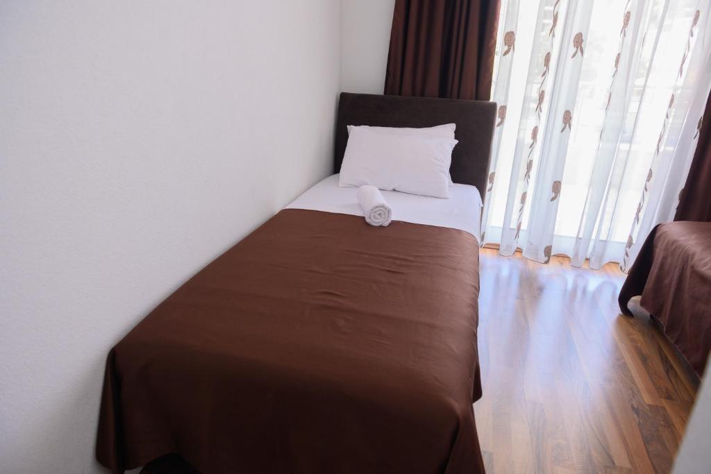Postel nebo postele na pokoji v ubytování MS Hotel
