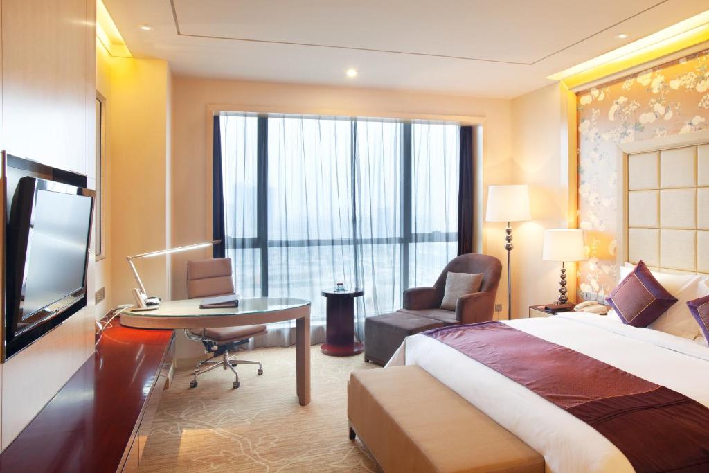 Postel nebo postele na pokoji v ubytování Crowne Plaza Xiangyang by IHG