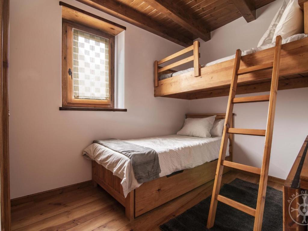 Postel nebo postele na pokoji v ubytování CASA REINA de Alma de Nieve