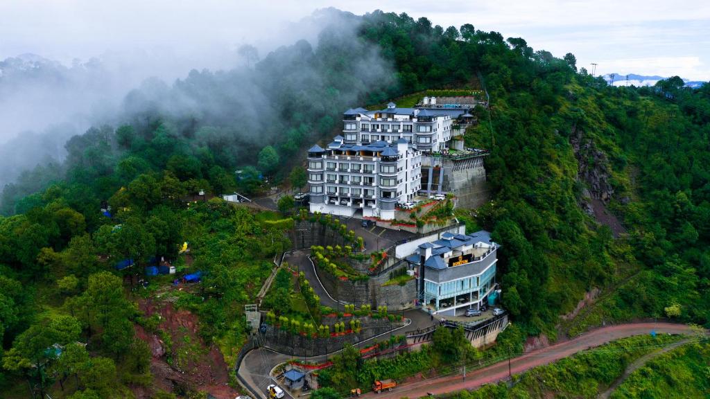 a building on the side of a mountain at Rosetum Kasauli in Kasauli