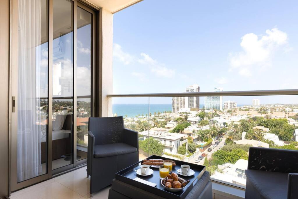 a living room with a view of the ocean at Sea View Heaven by Five Stay in Herzliya B