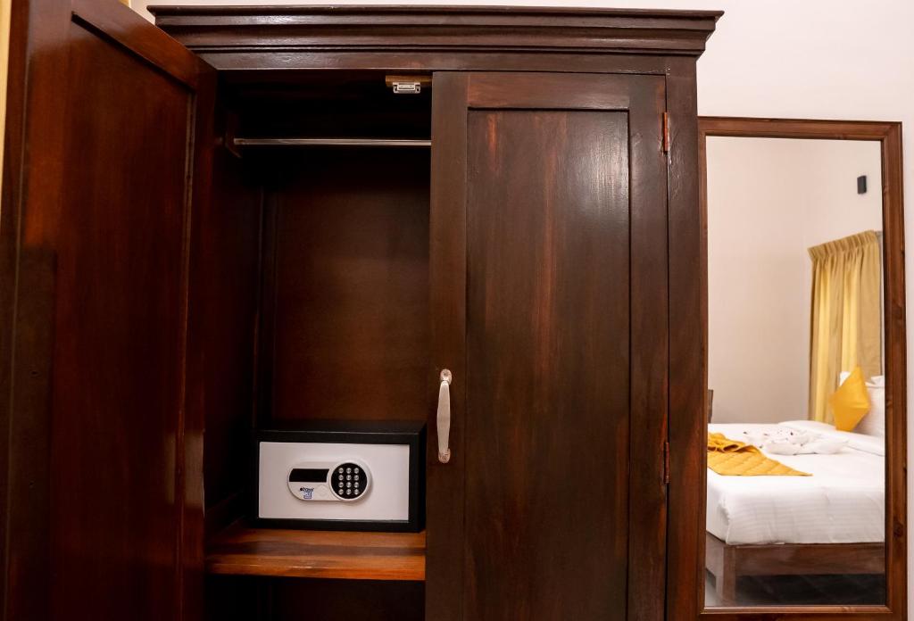 Postel nebo postele na pokoji v ubytování Palais de Pondichéry