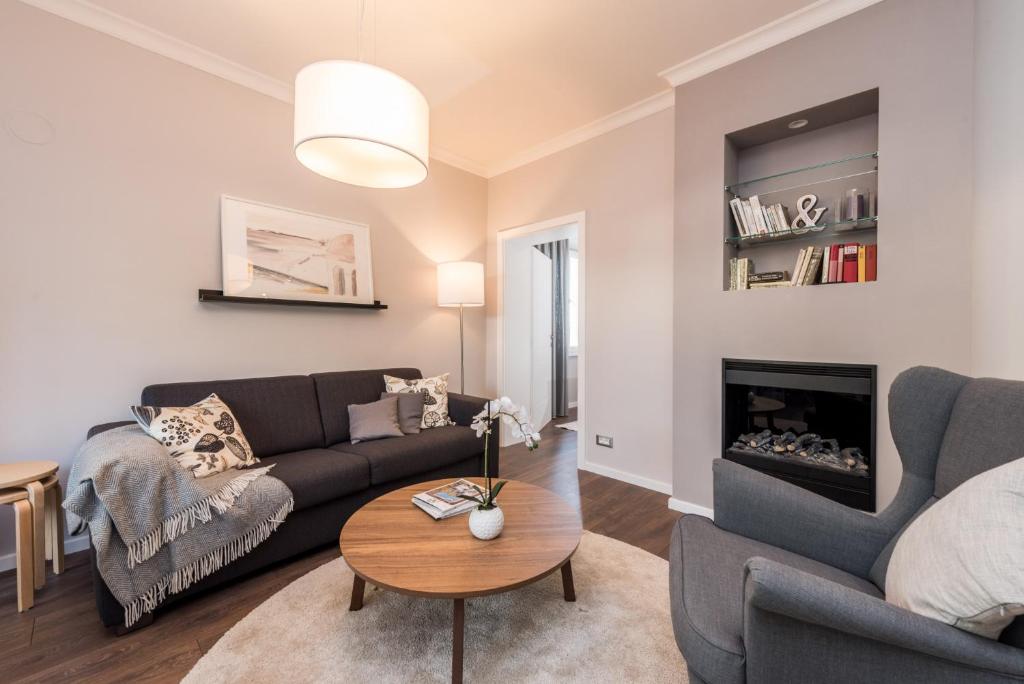 a living room with a couch and a table at Sunset Beach Apartment in Zadar