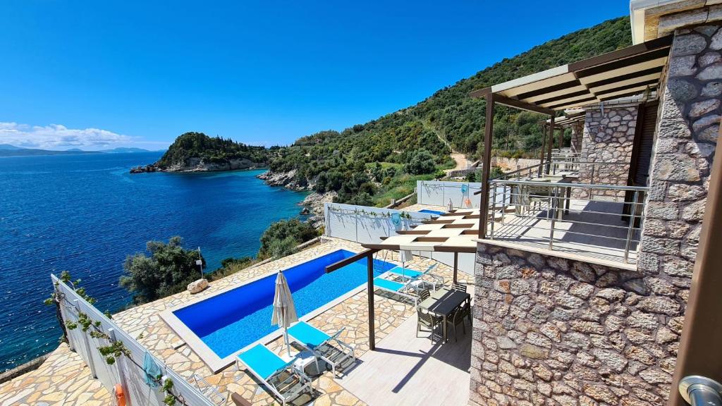 a villa with a view of the ocean at Amousso Beach Villas in Marantochori