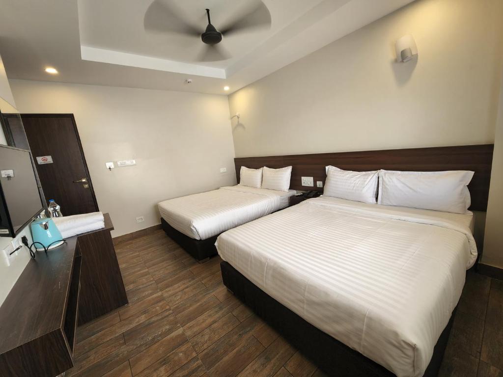 Postel nebo postele na pokoji v ubytování HOTEL PARK KRISHNA