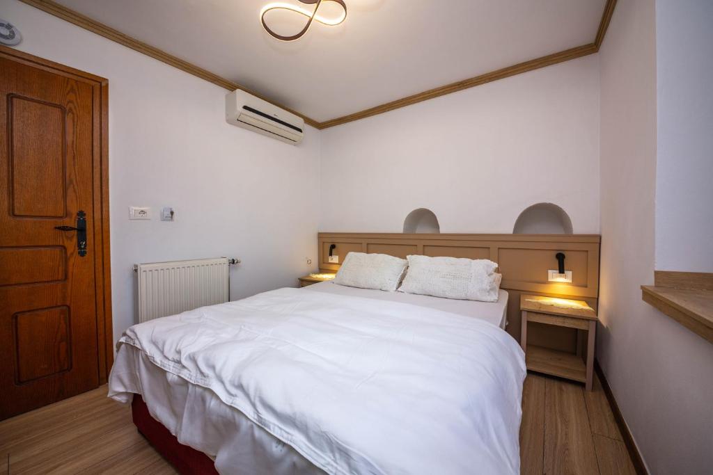 Postel nebo postele na pokoji v ubytování Bed and Breakfast Kotoni