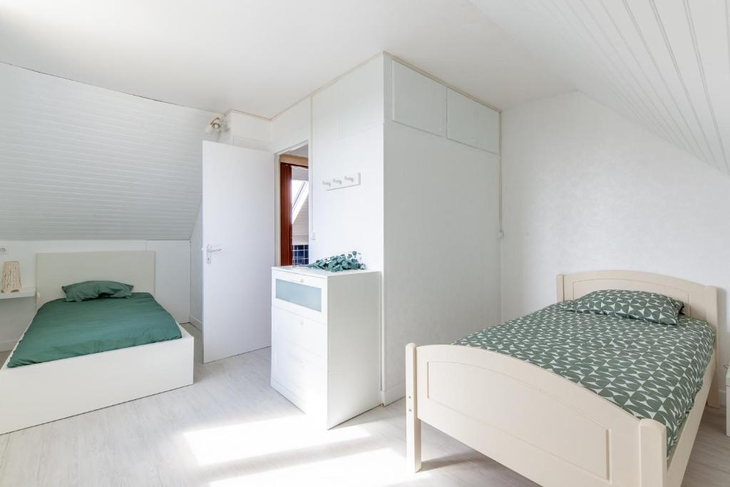 Posteľ alebo postele v izbe v ubytovaní La maison des dunes - Proche plage pour 6