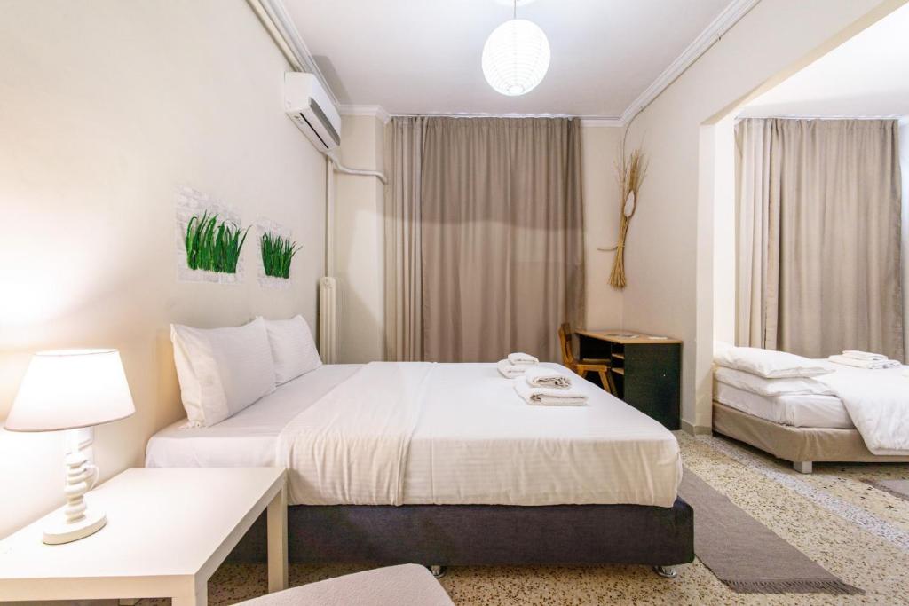 A bed or beds in a room at Zacharitsa APT at Acropolis up 4 guests by LODGESPOT