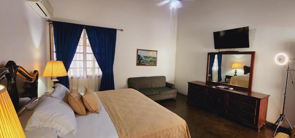 Postel nebo postele na pokoji v ubytování Camilas Hotel